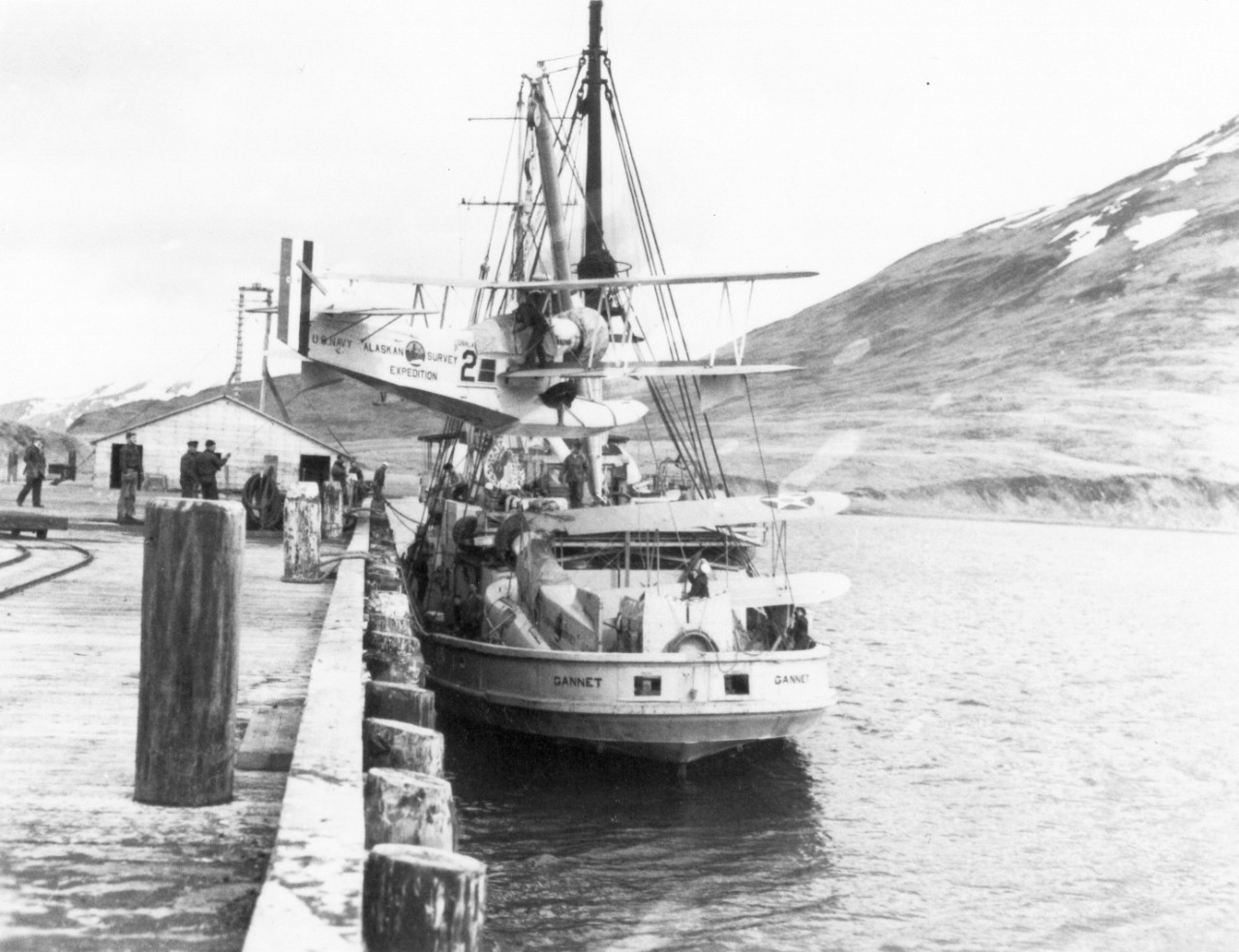 <p>UA 437.04.15 Preparing to leave Dutch Harbor for the westward, 18 May. This shows method of securing planes on deck. The second plane was nested in the cradle, fully assembled.</p>
