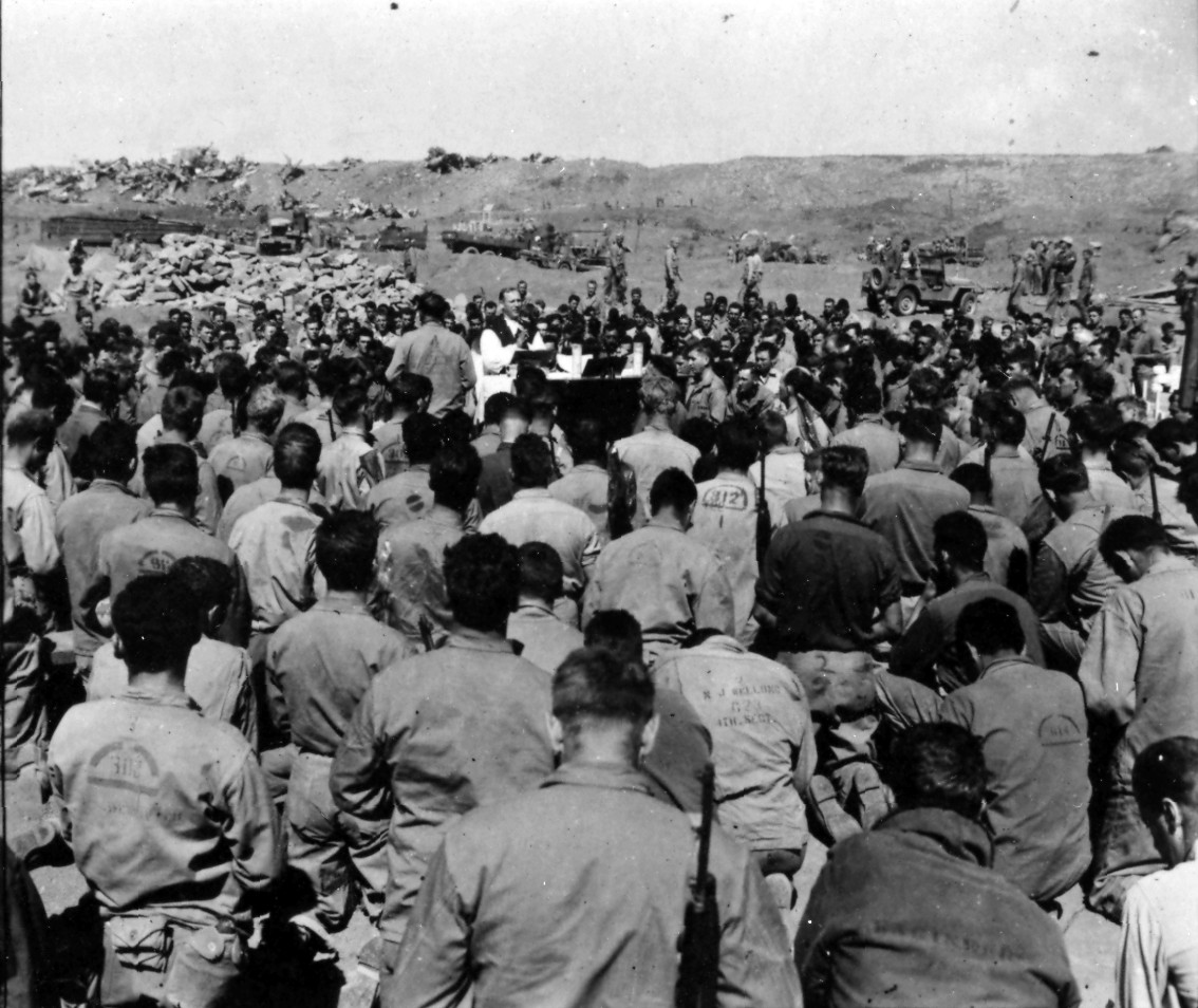 <p>A Catholic service at the dedication ceremony for a 4th Division cemetery at Iwo Jima. Image is from the Admiral Harry W. Hill Collection.</p>
