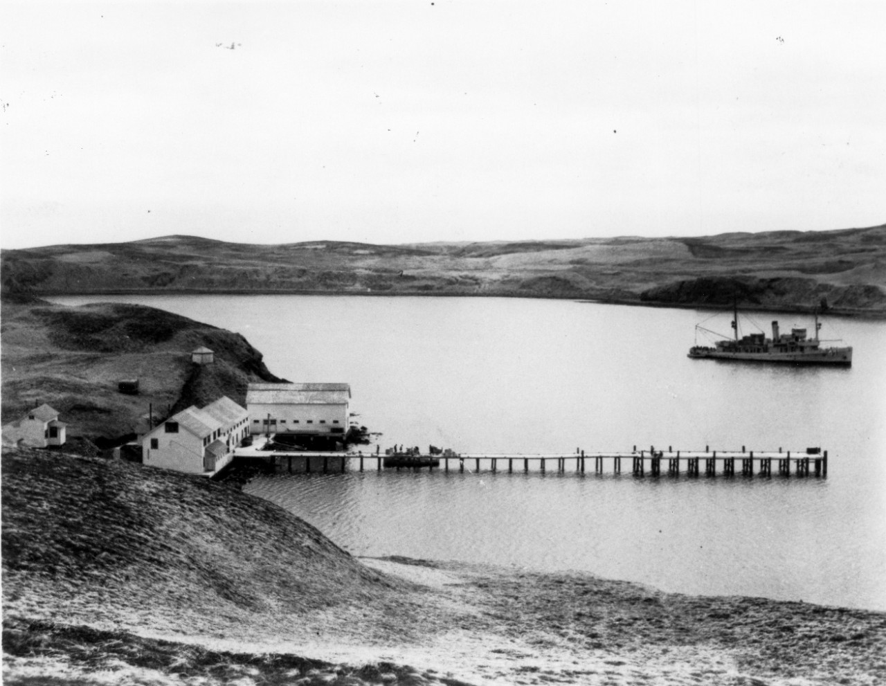 <p>UA 437.04.005 &quot;Gannet at anchor in Kanaga Bay. Housees and dock of the Kanaga Ranching Company.&quot;</p>
