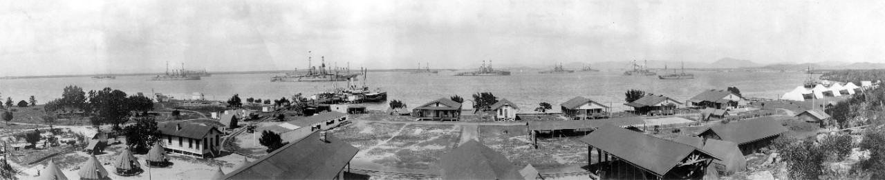 Oversize photograph (reproduction) of the Asiatic Fleet at anchor at Pyeng Yang (now Pongyang), Korea, circa 1931-1932. The image was taken from the porch of the dormitory of the Pyeng Tang Foreign School, possibly by Adaline Ashe, the house mother of the school (and grandmother of the donor). 