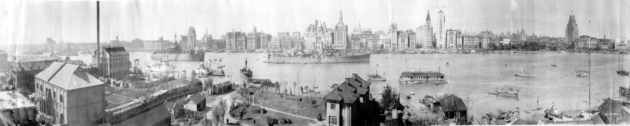 Oversize panoramic of Shanghai, China, October 10, 1945 - river & city view showing various ships, including USS Nashville (CL-43) and USS Rocky Mount (AGC-3). U.S. and British destroyers, Chinese patrol vessel, lightship, buoy tender, accommodation barge, patrol boats, and tugs. In the lower left is noted that Japanese prisoners are outside the building. 